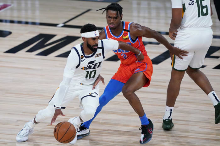 Mike Conley (10) drives through the lane against the Oklahoma City Thunder